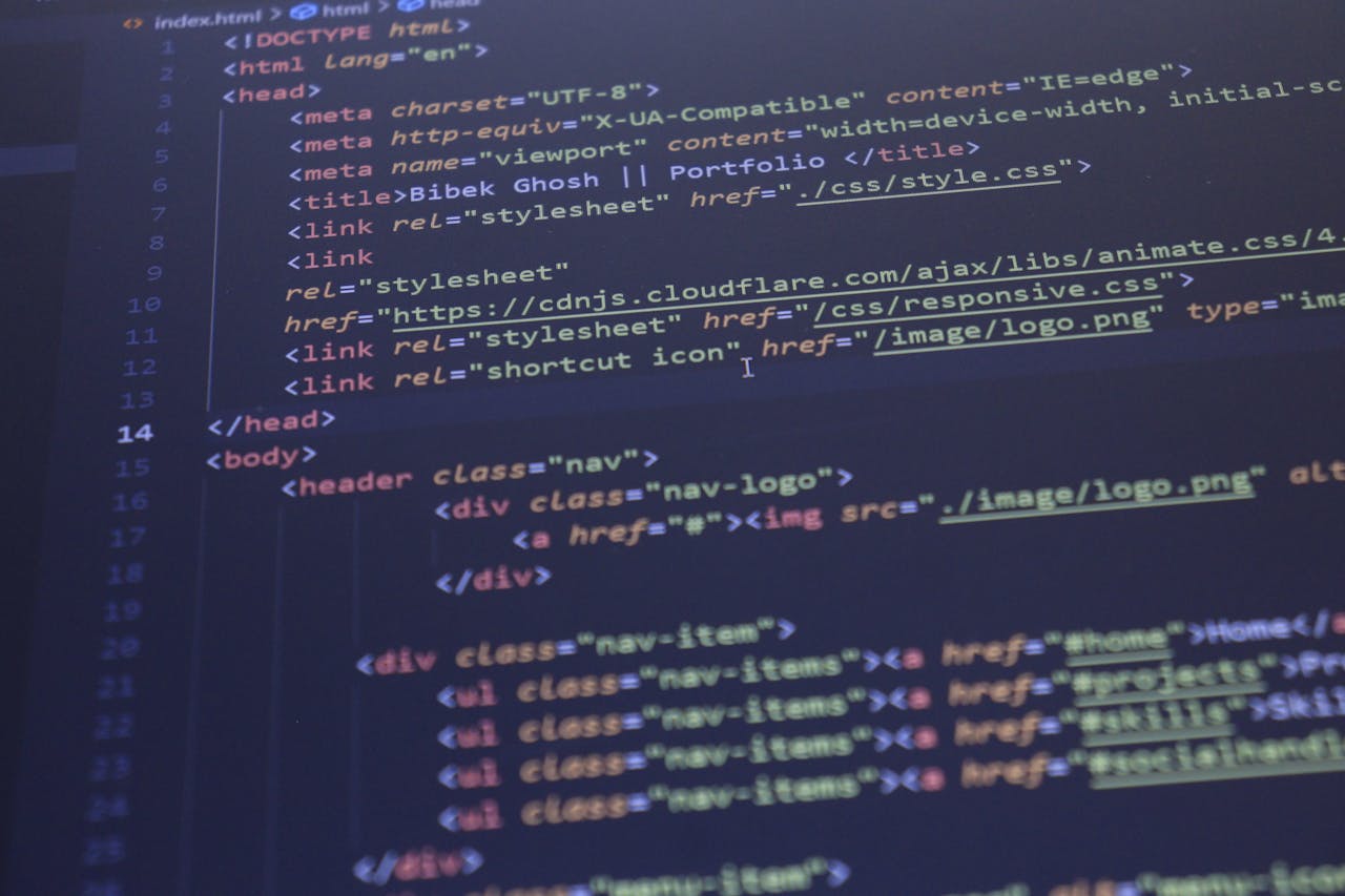 about-02 Close-up view of HTML and CSS code displayed on a computer screen, ideal for programming and technology themes.